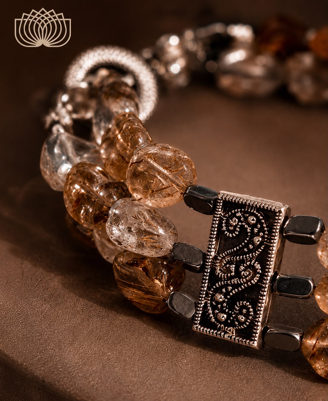 Desert glow.    
Rotel quartz 
Hematite 
Sterling Silver 925