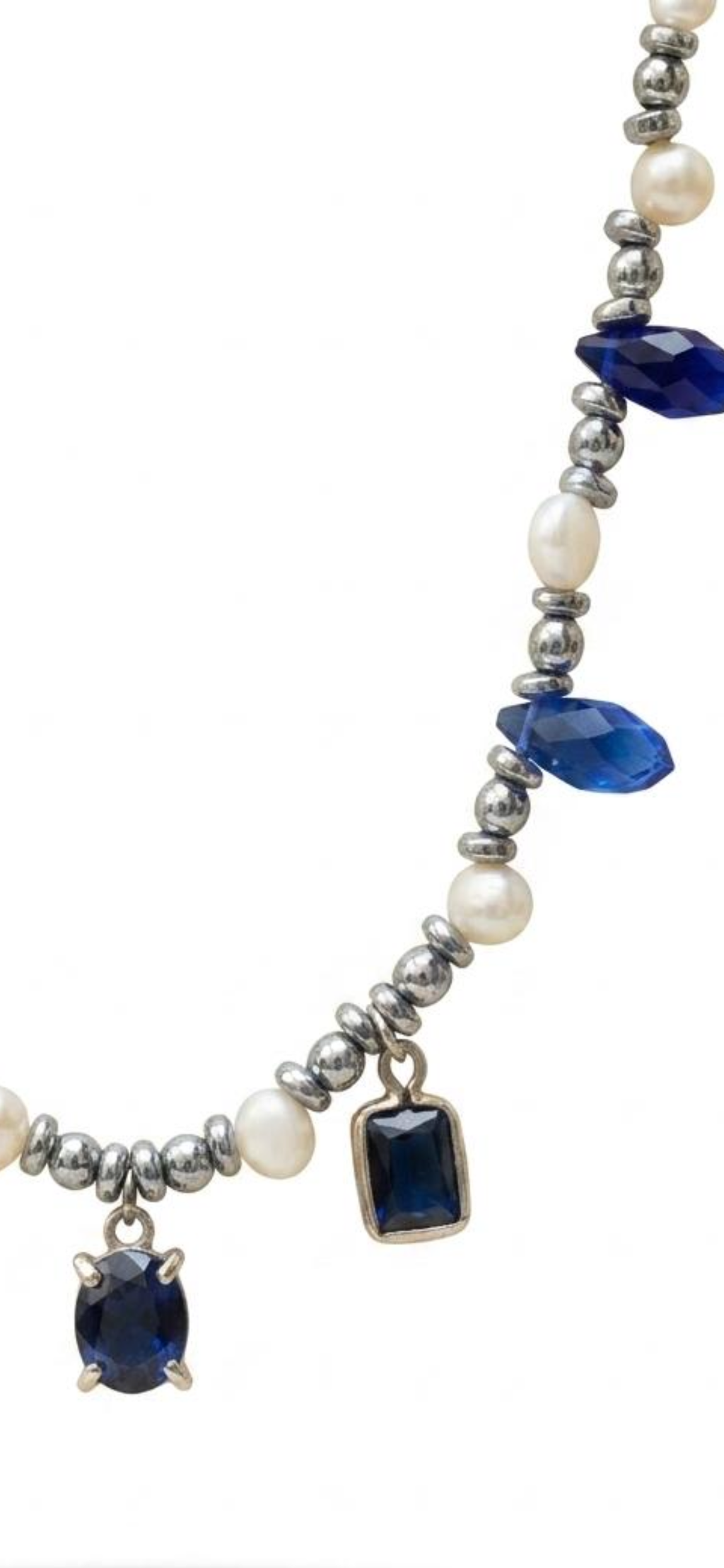 White and grey pearl
Hematite 
Blue crystal 
Blue Cubic zirconia pendants 
Sterling silver 925