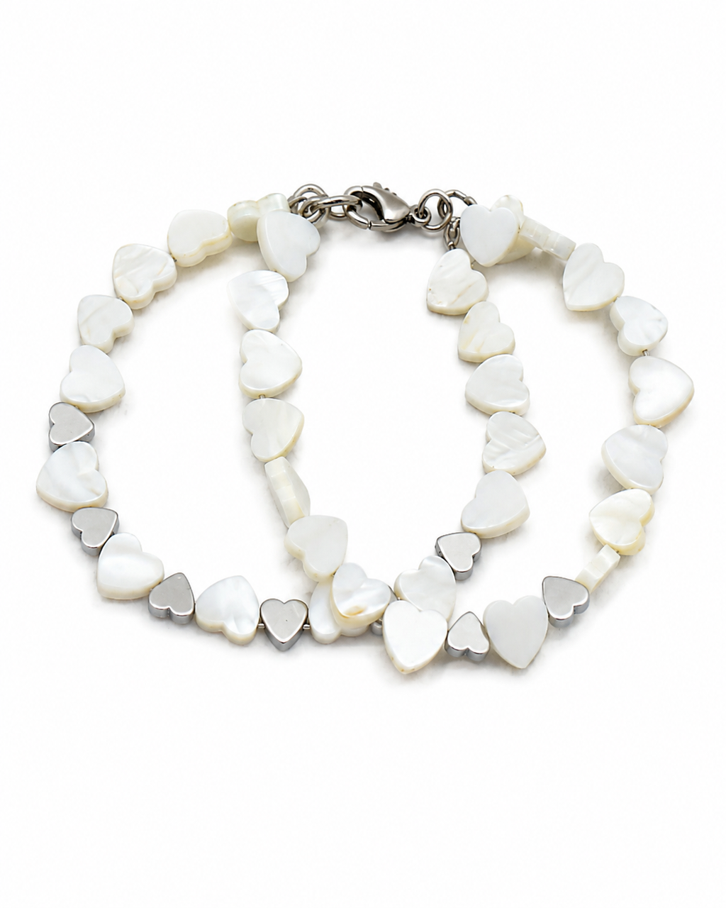 Heart to heart.     
Mother of pearl 
Hematite 
Sterling Silver 925
