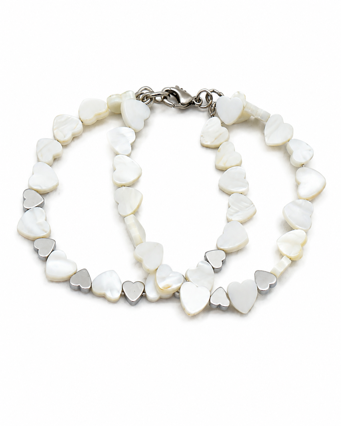 Heart to heart.     
Mother of pearl 
Hematite 
Sterling Silver 925