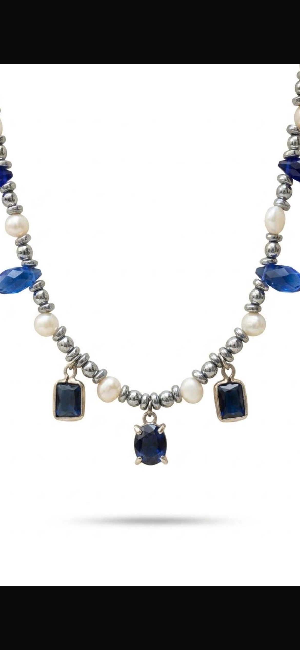 White and grey pearl
Hematite 
Blue crystal 
Blue Cubic zirconia pendants 
Sterling silver 925