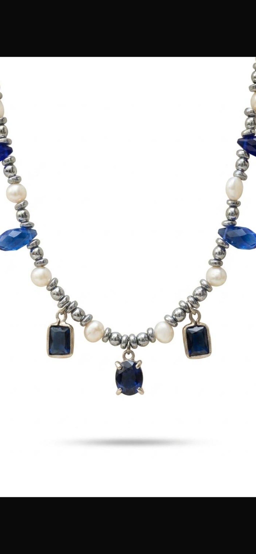 White and grey pearl
Hematite 
Blue crystal 
Blue Cubic zirconia pendants 
Sterling silver 925