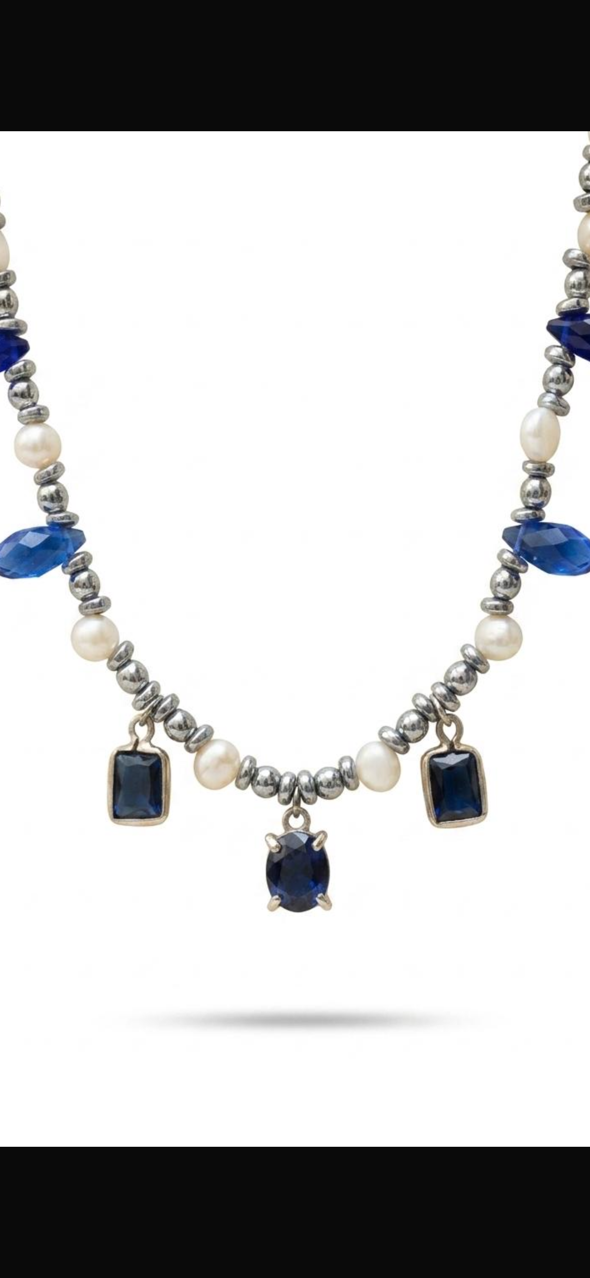 White and grey pearl
Hematite 
Blue crystal 
Blue Cubic zirconia pendants 
Sterling silver 925