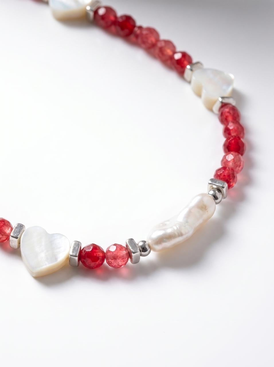 Pink jade 
Mother of pearl 
Pearl 
Hematite 
Sterling silver 925