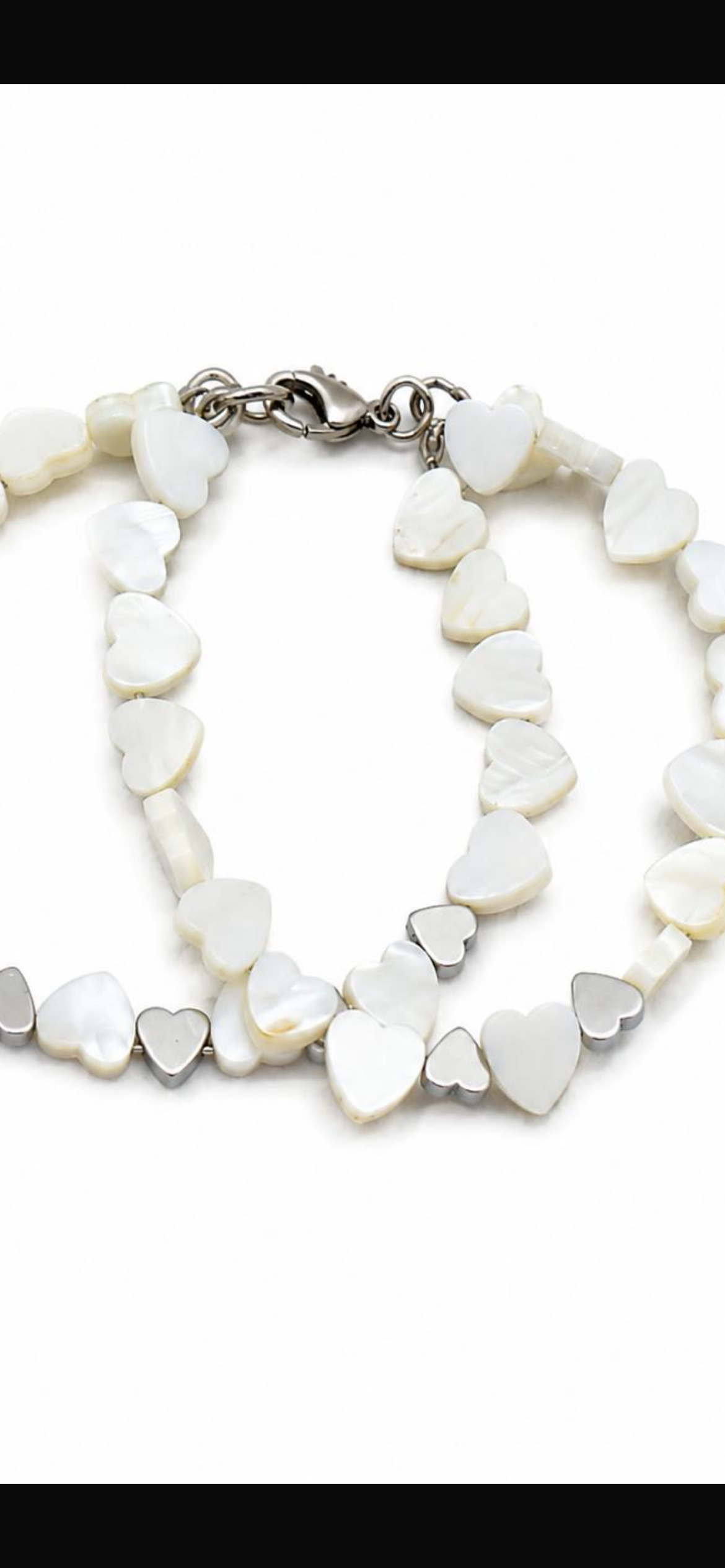 Heart to heart.     
Mother of pearl 
Hematite 
Sterling Silver 925